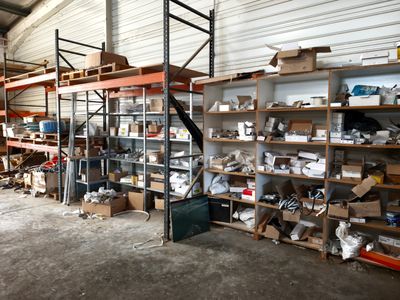 a room with a lot of shelves and shelves filled with assorted items