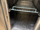 an open oven door with a rack in it