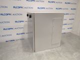 an image of a metal cabinet in front of a blue and white wall