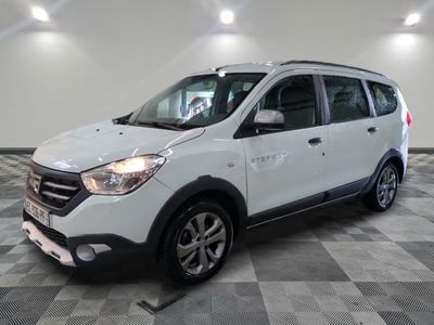 a picture of a white car in a showroom