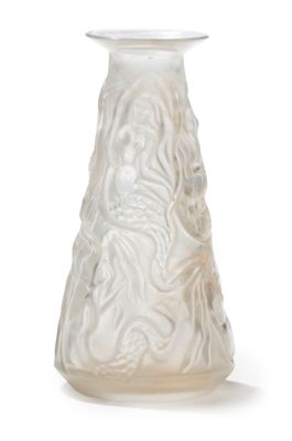 a white vase with a design on it on a white surface