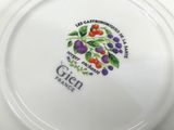 a plate with a design on it sitting on a table