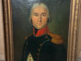 portrait d'un homme en uniforme militaire dans un cadre doré