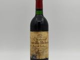 a bottle of wine sitting on top of a white table