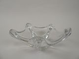 a clear glass bowl that is sitting on a table