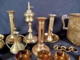 many different types of brass objects on a table