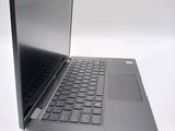 a laptop that is sitting on a white surface