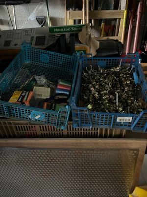 two baskets of tools sitting on top of a table