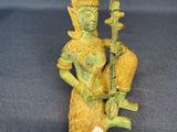 an image of a statue of a woman holding a guitar