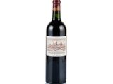 a close up of a bottle of red wine on a white background