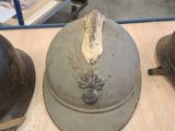 several helmets are lined up on a table in a warehouse