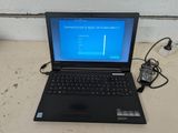 a laptop computer that is sitting on a table