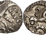 a silver coin with an image of a man on a horse