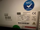 a close up of a label on the back of a refrigerator