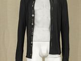 a mannequin wearing a black jacket and white pants