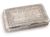 an antique silver box with a picture of a castle on it