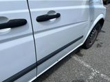 a white van that is parked in a parking lot
