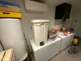 an image of a kitchen with a refrigerator and a refrigerator freezer