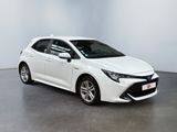 a white toyota corollant parked in a white room