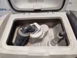 a toilet that has a water tank in it