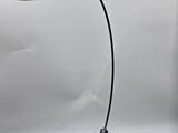 a black table lamp with a black base and a white background