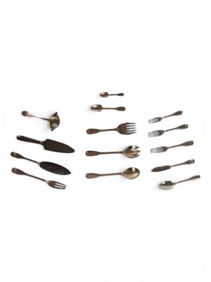 several forks and spoons are arranged in a circle on a white surface