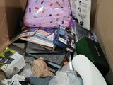 a cardboard box with a toilet and other items in it