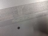 a close up of a piece of metal with holes on it