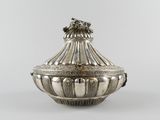 an antique silverplated sugar dish with a lion head on the lid