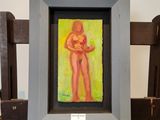 un tableau représentant une femme tenant un bébé dans un cadre