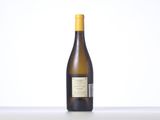 a bottle of white wine sitting on top of a table