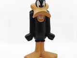 the toy figure of a goofy duck is posed on a white surface