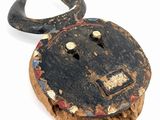 a wooden bull head with horns on a piece of wood