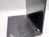 a laptop with a black keyboard on a white surface