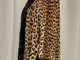 an image of a mannequin mannequin with a leopard print coat on it