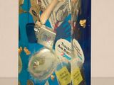 a doll that is sitting inside of a box with money