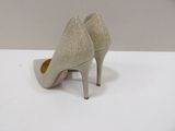 a close up of a pair of shoes on a white surface