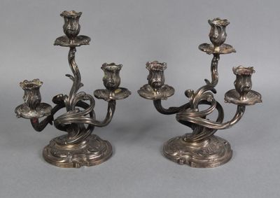 pair of silver plated candlesticks with birds and flowers on them