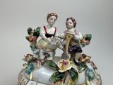 two figurines that are sitting on top of each other