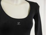 black long sleeved top with a small logo on the chest