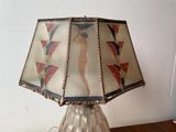 a lamp that has a picture of a woman on it