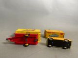 two toy trains sitting next to each other on a table