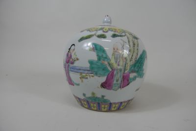 a white vase with a painting on it sitting on a table
