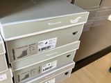 many boxes stacked on top of each other on the floor