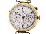 une montre de poche en or avec un cadran blanc et une trotteuse rouge