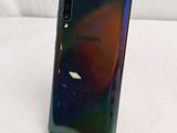 the back of a samsung galaxy note 10 lite phone on a stand
