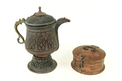 a small teapot and a small box on a white surface