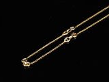 a pair of gold chain bracelets with a diamond clasp