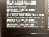a hand holding a cell phone with a barcode on it