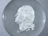 a glass ball with a picture of a man on it